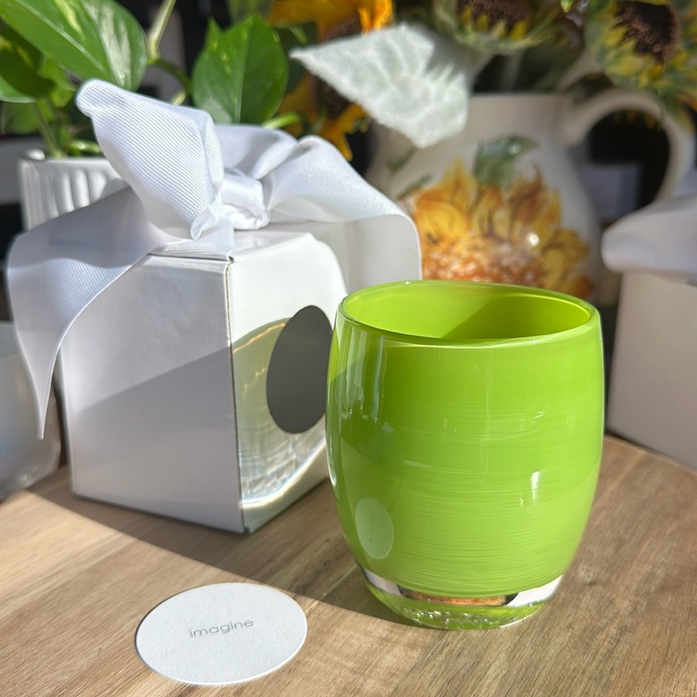 Vibrant green glassybaby “imagine” glass votive.